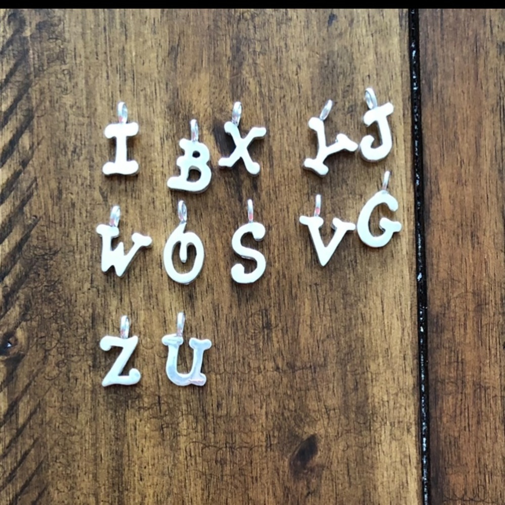 Letter pendants, silver.